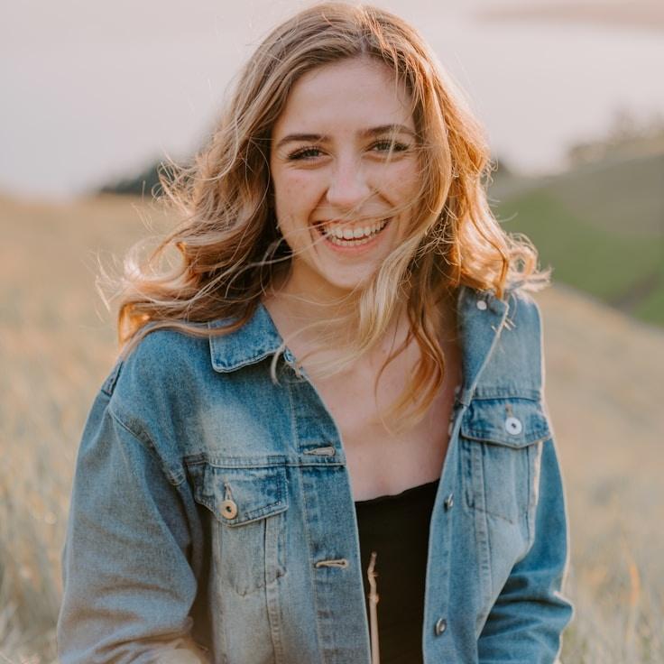 Kaveri Mehta, Lead Design Curator at QuillShoreHaven, reviewing corporate floral arrangements